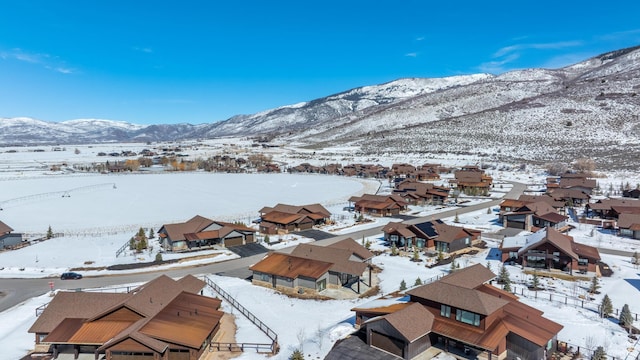 272 Thorn Creek Dr, Kamas, UT 84036 - snowy aerial view featuring a mountain view and a residential view