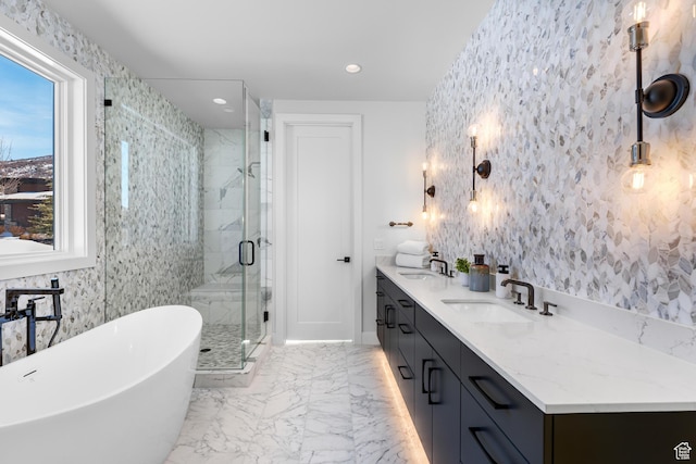 272 Thorn Creek Dr, Kamas, UT 84036 - full bath featuring a freestanding tub, a marble finish shower, double vanity, recessed lighting, and baseboards