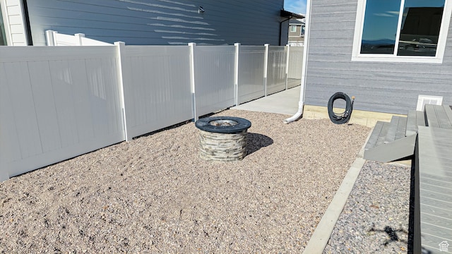 1396 S Castillo Rd W Unit 102, Spanish Fork, UT 84660 - exterior space featuring a fire pit and fence