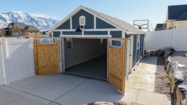 1396 S Castillo Rd W Unit 102, Spanish Fork, UT 84660 - view of outdoor structure featuring a mountain view and fence