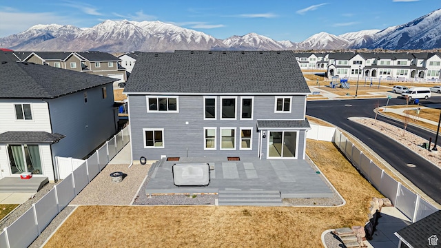 1396 S Castillo Rd W Unit 102, Spanish Fork, UT 84660 - back of house featuring a residential view, a patio area, a fenced backyard, and a mountain view