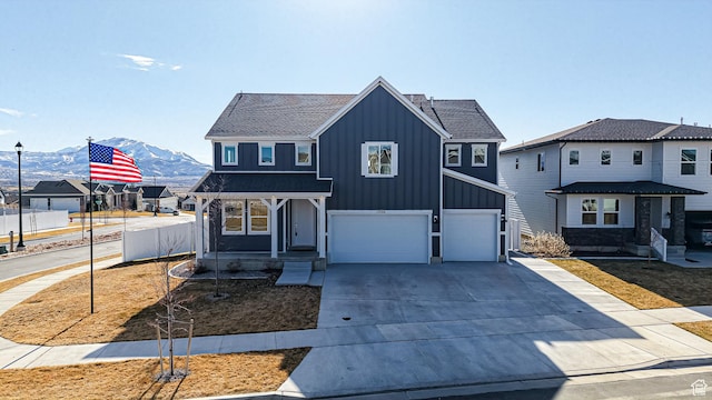 1396 S Castillo Rd W Unit 102, Spanish Fork, UT 84660 - view of front of home featuring a garage, concrete driveway, fence, a mountain view, and board and batten siding
