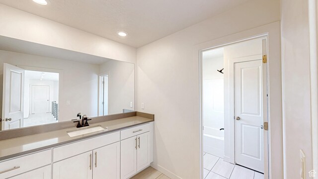 1396 S Castillo Rd W Unit 102, Spanish Fork, UT 84660 - bathroom featuring recessed lighting, baseboards, and vanity