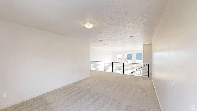 1396 S Castillo Rd W Unit 102, Spanish Fork, UT 84660 - carpeted empty room with a textured ceiling and baseboards