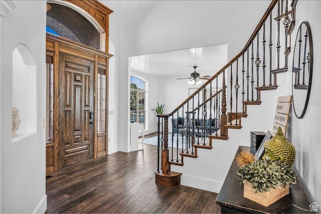 470 E 130 S, Ivins, UT 84738 - foyer with arched walkways, ceiling fan, dark wood-type flooring, baseboards, and stairway