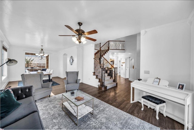 470 E 130 S, Ivins, UT 84738 - living room featuring baseboards, arched walkways, dark wood-style flooring, stairs, and ceiling fan with notable chandelier