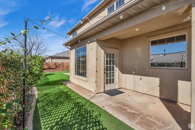 470 E 130 S, Ivins, UT 84738 - doorway to property with a patio area, fence, a lawn, and stucco siding