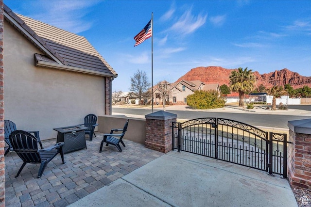 470 E 130 S, Ivins, UT 84738 - view of patio with a gate, a mountain view, and fence