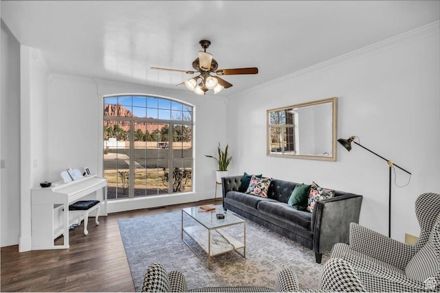 470 E 130 S, Ivins, UT 84738 - living area featuring baseboards, visible vents, dark wood finished floors, a ceiling fan, and ornamental molding
