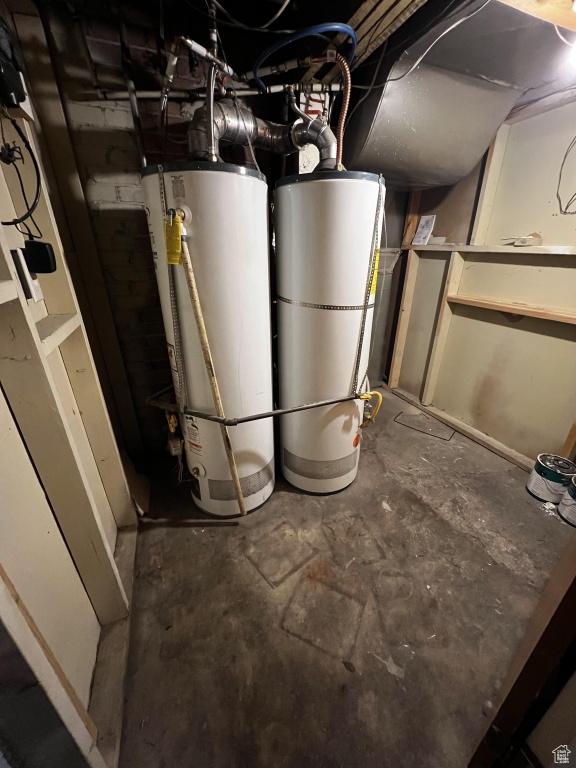 utilities with strapped water heater and gas water heater