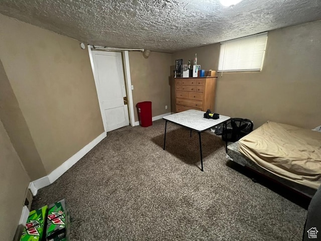 carpeted bedroom with a textured ceiling and baseboards