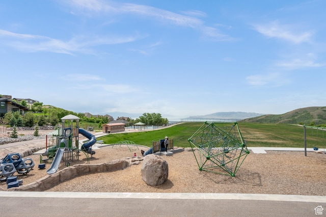 community jungle gym with a mountain view