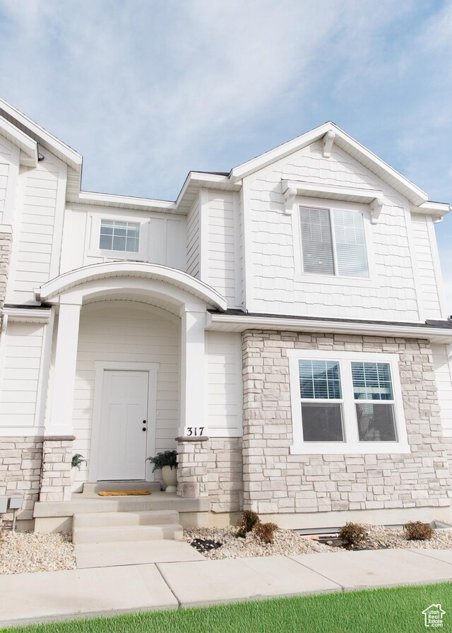 view of front facade with stone siding