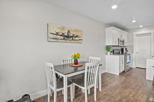 6471 S Aspen Ln, South Weber, UT 84405 - dining area with dark wood finished floors, recessed lighting, and baseboards