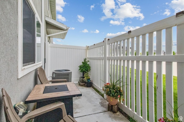 6471 S Aspen Ln, South Weber, UT 84405 - view of patio featuring central AC and fence