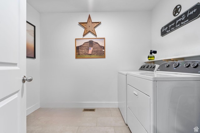 6471 S Aspen Ln, South Weber, UT 84405 - laundry room featuring washing machine and dryer, light tile patterned floors, and baseboards
