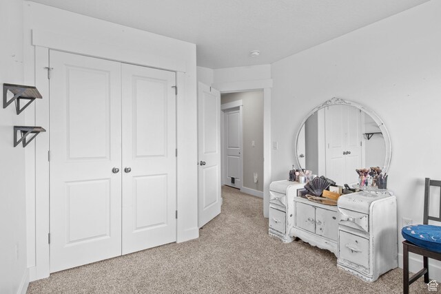 6471 S Aspen Ln, South Weber, UT 84405 - bedroom featuring light carpet, a closet, and baseboards