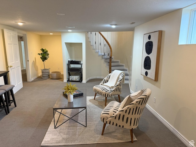 living room with baseboards, stairway, recessed lighting, and carpet