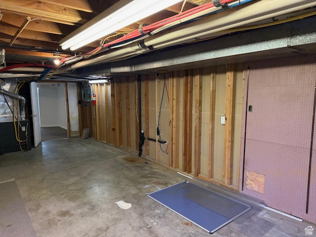 unfinished basement with heating unit