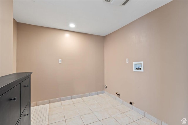 clothes washing area with cabinet space, gas dryer hookup, hookup for a washing machine, baseboards, and recessed lighting
