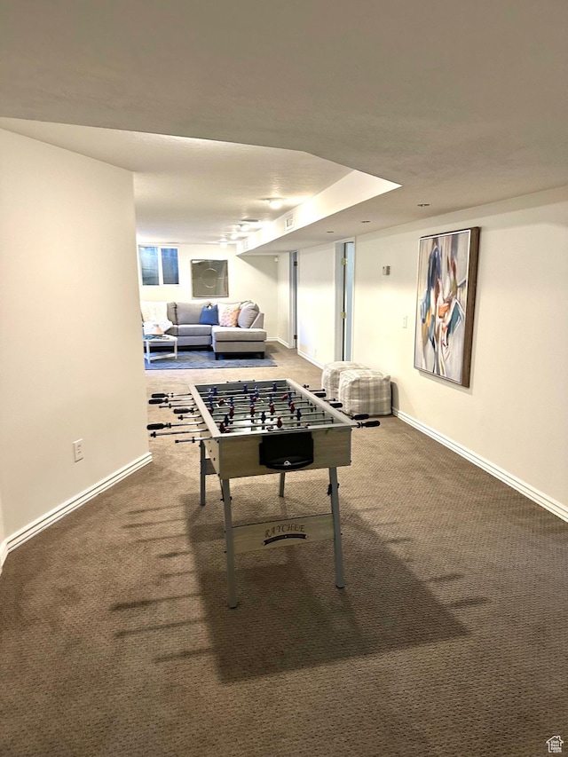 game room featuring carpet and baseboards