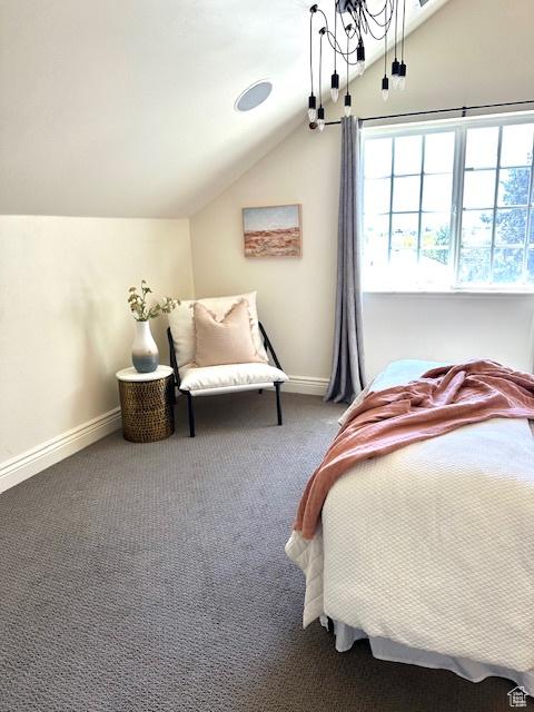 bedroom featuring vaulted ceiling, baseboards, and carpet floors