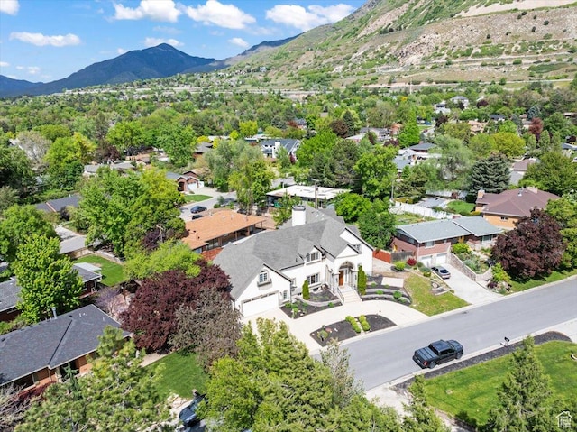 birds eye view of property featuring a mountain view and a residential view