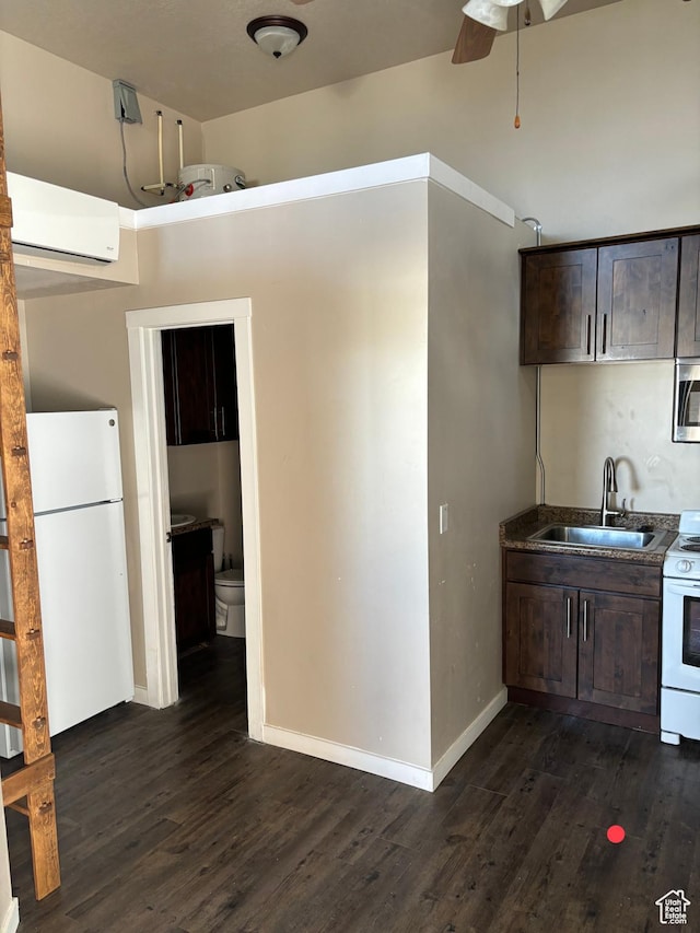 2573 S 2800 W, Roosevelt, UT 84066 - kitchen featuring white appliances, dark countertops, dark brown cabinets, an AC wall unit, and a sink