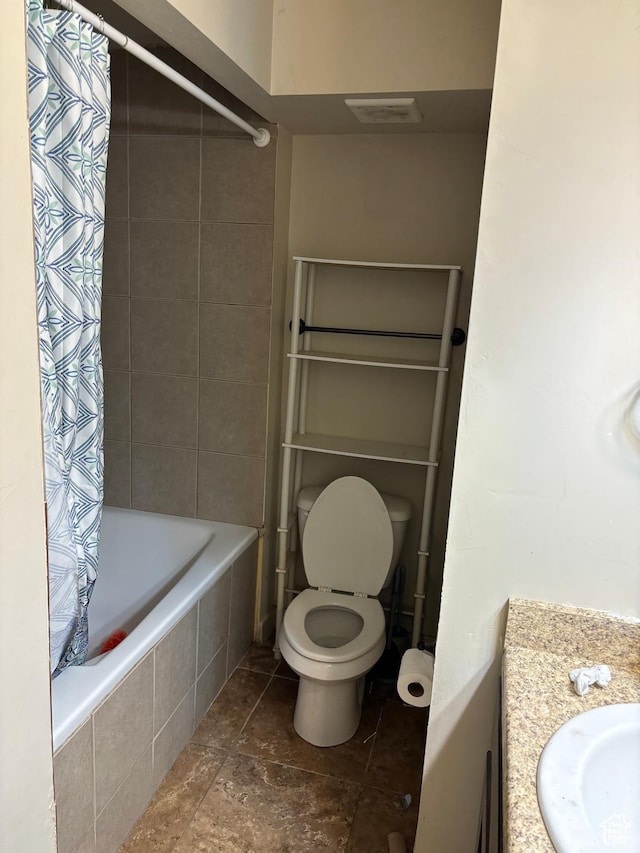 2573 S 2800 W, Roosevelt, UT 84066 - full bath featuring toilet, tiled shower / bath combo, visible vents, vanity, and stone finish floor