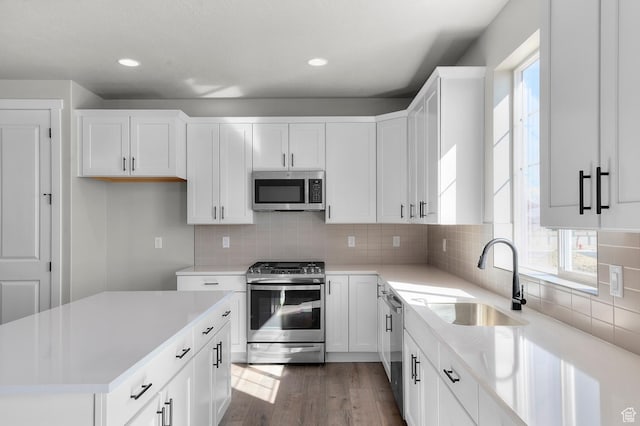 3707 W 2600 N, Lehi, UT 84043 - kitchen featuring wood finished floors, a sink, stainless steel appliances, light countertops, and white cabinets