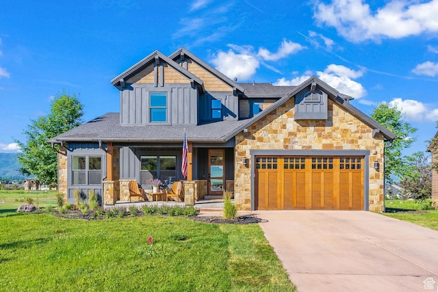 615 N Haystack Mountain Dr, Heber City, UT 84032 - craftsman inspired home with board and batten siding, a front yard, covered porch, and a garage