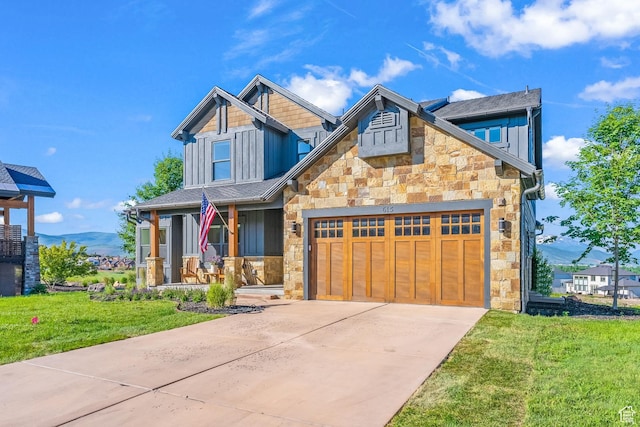 615 N Haystack Mountain Dr, Heber City, UT 84032 - craftsman-style home featuring stone siding, a porch, and board and batten siding