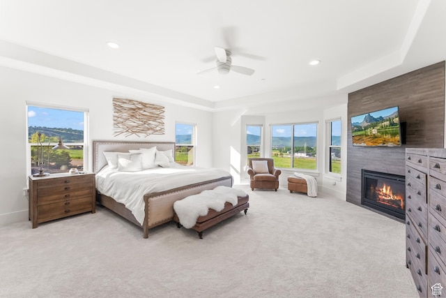 615 N Haystack Mountain Dr, Heber City, UT 84032 - bedroom with light carpet, a large fireplace, multiple windows, and recessed lighting