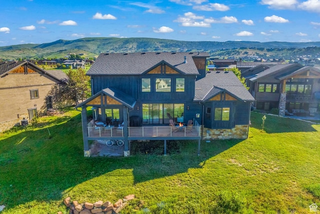 615 N Haystack Mountain Dr, Heber City, UT 84032 - rear view of house featuring a deck with mountain view, a yard, and a residential view