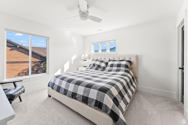 615 N Haystack Mountain Dr, Heber City, UT 84032 - bedroom featuring light colored carpet, ceiling fan, baseboards, and multiple windows
