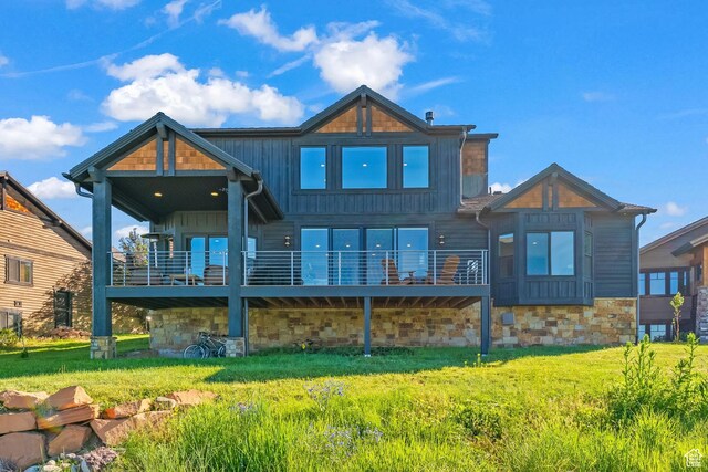 615 N Haystack Mountain Dr, Heber City, UT 84032 - rear view of property featuring a yard, board and batten siding, and stone siding