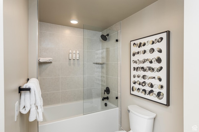 bathroom featuring toilet, recessed lighting, and shower / bathtub combination