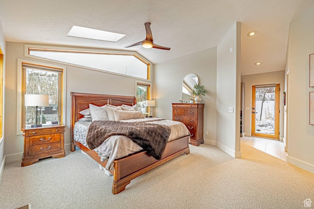 4414 Hidden Cove Rd, Park City, UT 84098 - bedroom featuring lofted ceiling with skylight, light carpet, baseboards, and multiple windows