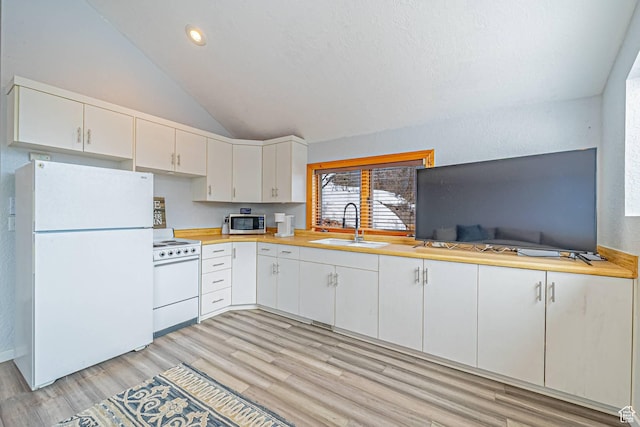 4414 Hidden Cove Rd, Park City, UT 84098 - kitchen featuring light countertops, white appliances, a sink, and white cabinets