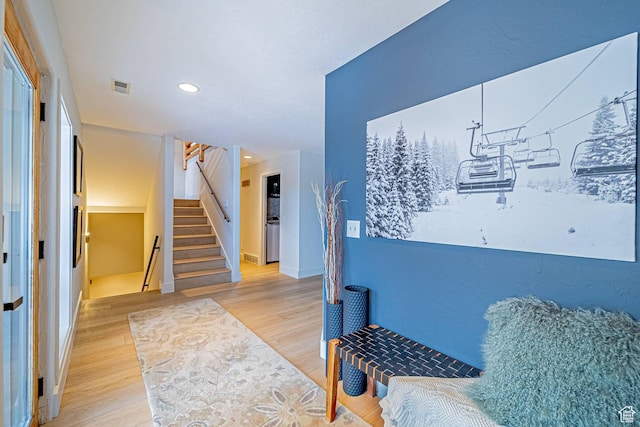 4414 Hidden Cove Rd, Park City, UT 84098 - sitting room with light wood-style floors, visible vents, stairway, and baseboards