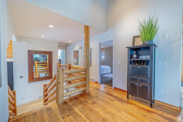4414 Hidden Cove Rd, Park City, UT 84098 - hall with recessed lighting, visible vents, light wood-style flooring, and an upstairs landing