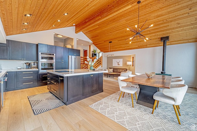 4414 Hidden Cove Rd, Park City, UT 84098 - kitchen with light countertops, appliances with stainless steel finishes, a center island, and pendant lighting