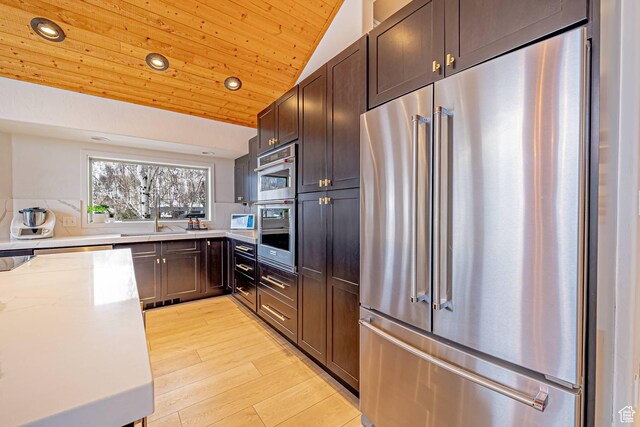 4414 Hidden Cove Rd, Park City, UT 84098 - kitchen featuring lofted ceiling, light stone counters, high quality fridge, wooden ceiling, and light wood-style flooring