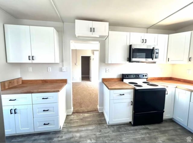 330 E 300 N, Price, UT 84501 - kitchen with stainless steel microwave, white cabinetry, dark wood-style floors, and range with electric stovetop