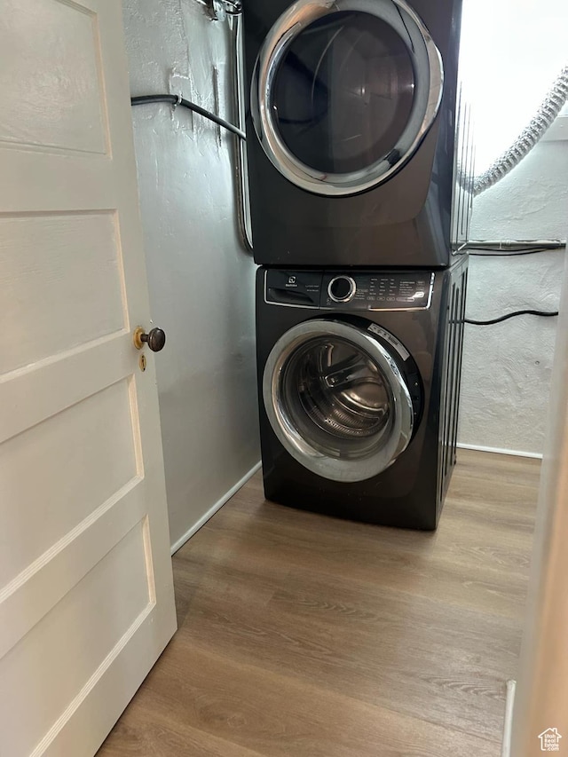330 E 300 N, Price, UT 84501 - laundry area featuring stacked washer / dryer, laundry area, and wood finished floors