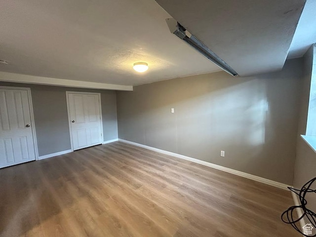 330 E 300 N, Price, UT 84501 - unfurnished bedroom with baseboards, a closet, and wood finished floors