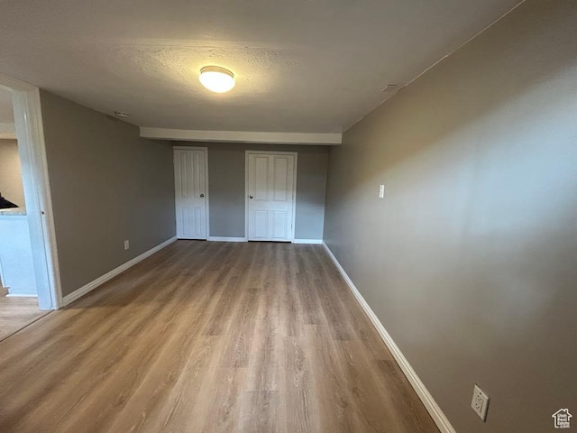 330 E 300 N, Price, UT 84501 - unfurnished bedroom featuring a closet, a textured ceiling, wood finished floors, and baseboards
