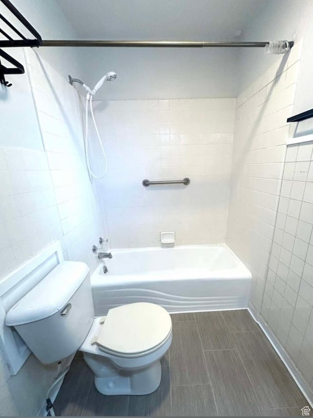 330 E 300 N, Price, UT 84501 - bathroom with bathing tub / shower combination, tile walls, toilet, and tile patterned floors