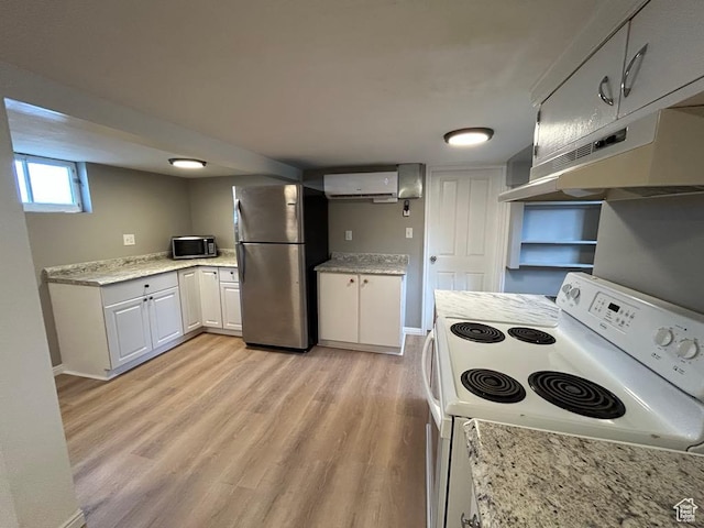 330 E 300 N, Price, UT 84501 - kitchen featuring light wood finished floors, stainless steel appliances, white cabinets, under cabinet range hood, and a wall mounted AC