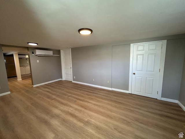 330 E 300 N, Price, UT 84501 - interior space with baseboards, a wall unit AC, and wood finished floors